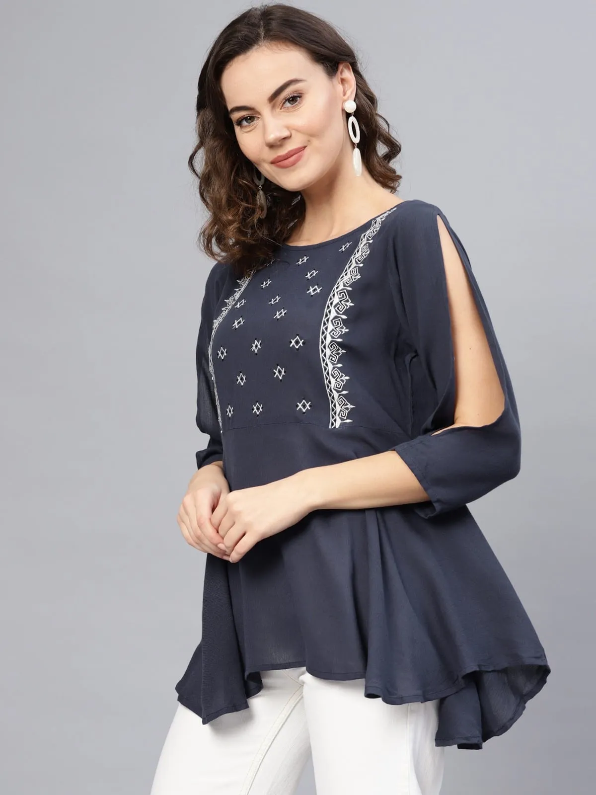 Embroidered Peplum Top